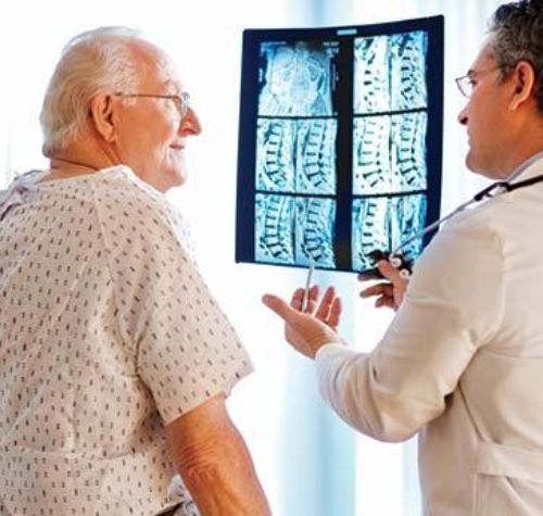 acdf-doctor-talk-to-patient-with-spine-xrays