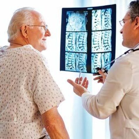 acdf-doctor-talk-to-patient-with-spine-xrays